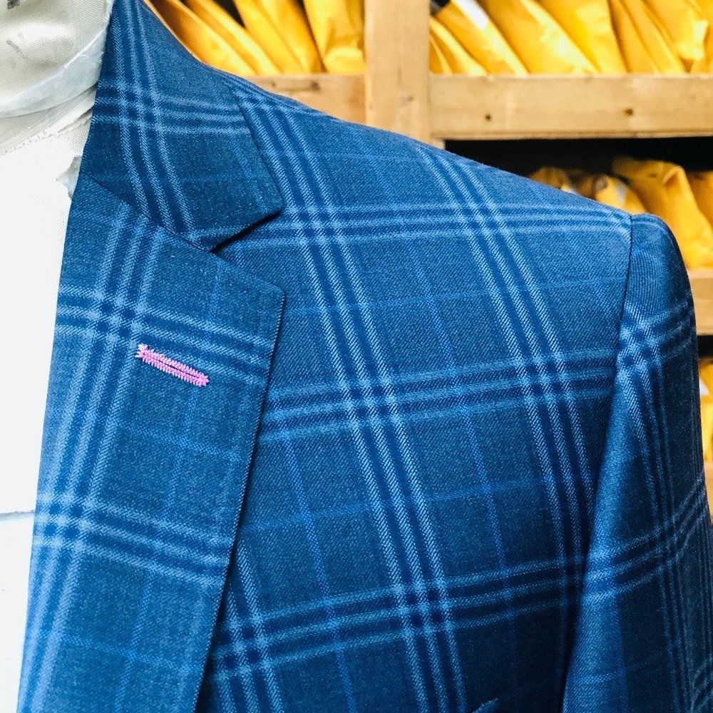 Teal windowpane jacket, pink lapel buttonhole