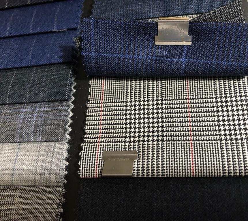 Swatches of navy and glen plaid suiting cloth